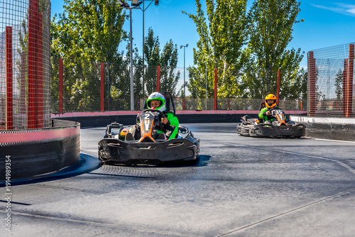 Cuadro en lienzo Kids racing go karts on track competition
