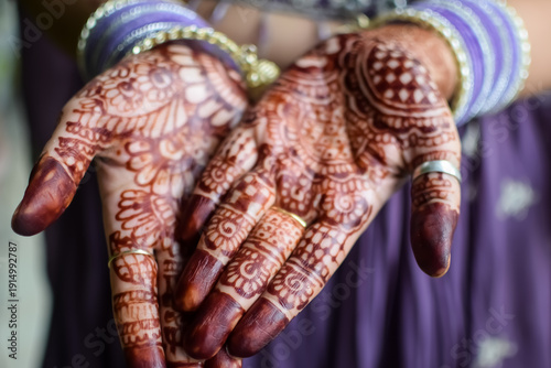 Beautiful woman dressed up as Indian tradition with henna mehndi design on her both hands to celebrate big festival of Karwa Chauth, Karwa Chauth celebrations by Indian woman for her husband