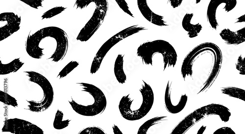Abstract seamless pattern with black textured brush strokes on a white background, creating a modern and artistic design.