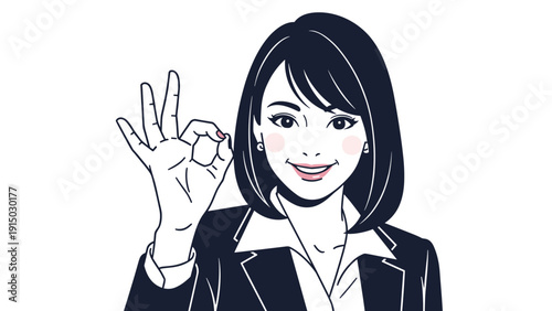 Smiling professional businesswoman in a dark suit making an okay hand gesture with a confident and friendly expression.