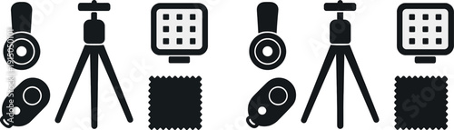 Various photography accessories are displayed, featuring a tripod for stability, a remote trigger for convenience, and a cleaning cloth for lens maintenance on a workspace.