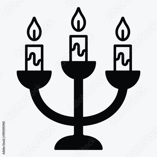 Candle holder with three lit candles in elegant design