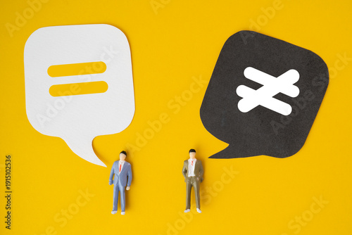 For equal and unequal , human rights, bias and personal mindset concept equal and unequal icon on real speech bubble paper cut with miniature businessman on yellow background