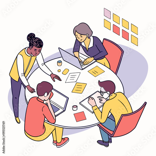 A group of people sitting around a table working on laptops and papers