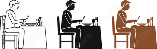 Man eating alone at a table with various dinner settings