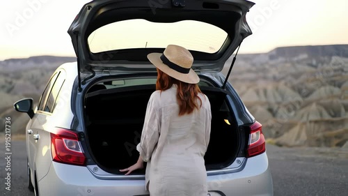 Woman Standing by Car Trunk.