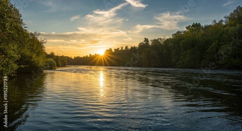 Sunset radiance illuminating a calm and charming river landscape