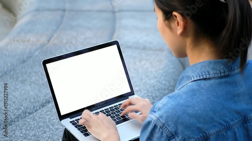 Woman Working on Laptop Outdoors.