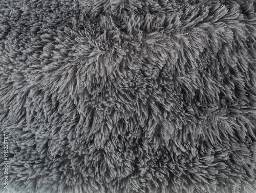 Canvas Print Top view of grey faux fur texture background with long hair fibers