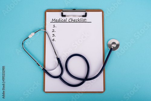 Tableau sur toile Medical Checklist on clipboard with stethoscope on blue background