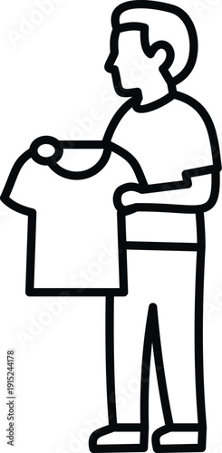 Man holding and folding a freshly washed t shirt, doing household laundry chores