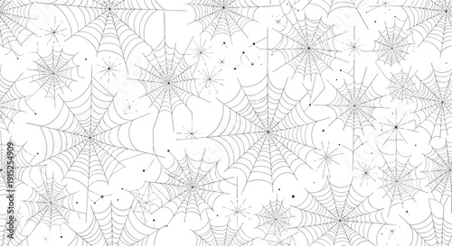 Seamless black and white pattern of intricate, overlapping spiderwebs and small spiders, creating a spooky and detailed background.