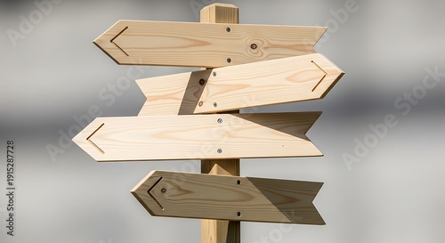 Wooden signpost with multiple directional arrows pointing different ways outdoors