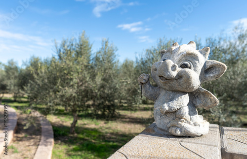Statue of a cute little dragon in the garden
