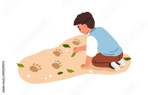 Kid discovering animal footprints, playing outdoors. Curious boy kneeling on ...