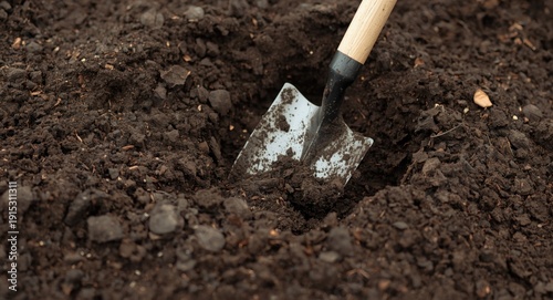 Digging rich soil with gard...