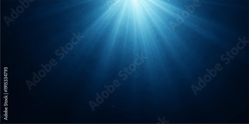 A bright blue star burst explosion creates glowing light rays and sun beams in a deep sea ocean backdrop with motion flare and underwater sunlight design
