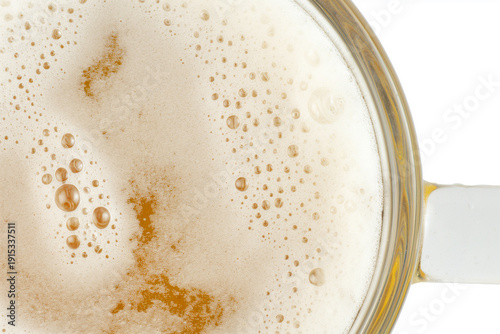 A close-up of a glass mug filled with beer, with a white background.
