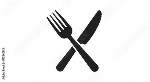 Crossed black fork and knife utensils on white background symbolizing food dining and meal preparation