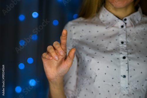 Woman making peace sign gesture