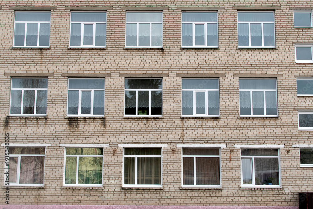 Fototapeta premium View of a building wall with windows