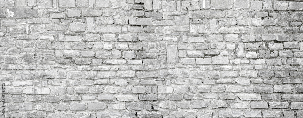 Fototapeta premium Gray rough stone wall textured background surface