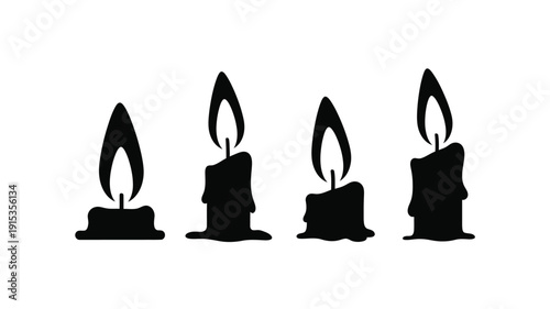 Four black candles with flickering flames a striking silhouette