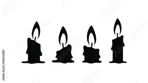 Four black candles with flickering flames a striking silhouette
