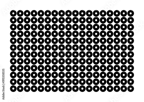 Black donuts arranged neatly in repetitive rows