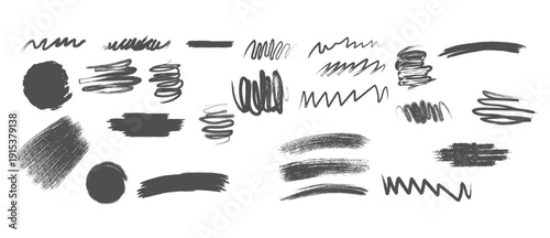 Collection of black brush strokes and scribbles on white background
