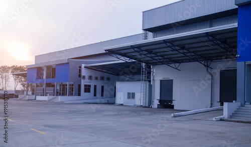 Foto Modern logistics center with shutter doors and loading ramps