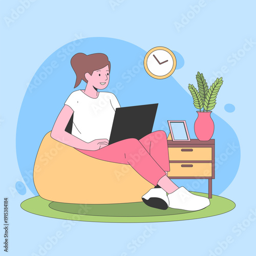 Woman working on a laptop while sitting on a beanbag