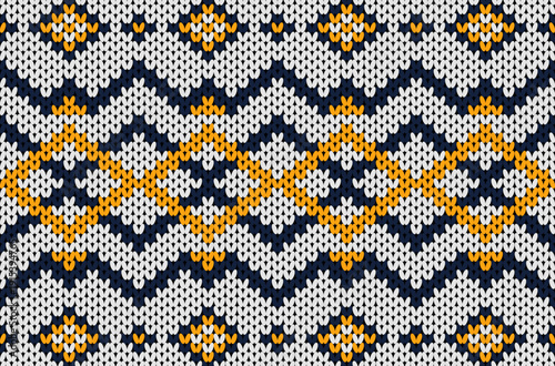Native ethnic knitted pattern in white, blue, and yellow tones.