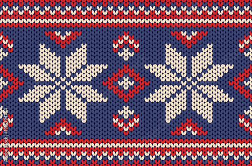 Christmas snowflake knitted sweater pattern in blue and red tones.