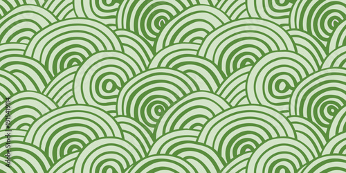 Seamless pattern of overlapping green spirals and curved shapes