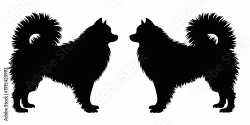 Two black silhouette dogs facing each other with fluffy tails and standing upright