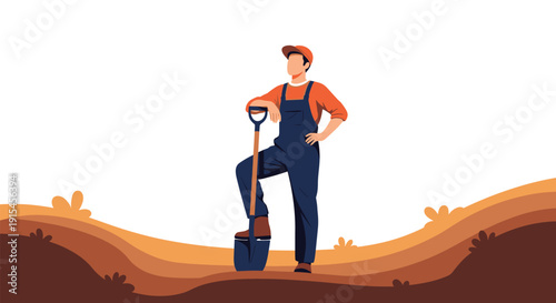 Male gardener in overalls standing with shovel on soil ground