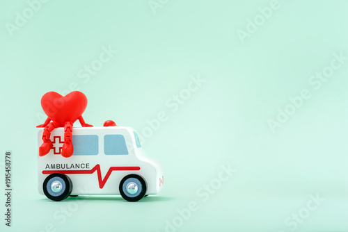 Miniature ambulnce toy car with red heart
