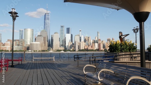 New York City Manhattan downtown financial district skyline, New Jersey Exchange Place, United States. Urban cityscape with skyscraper buildings, World Trade Center. J Owen Grundy park, Paulus Hook.