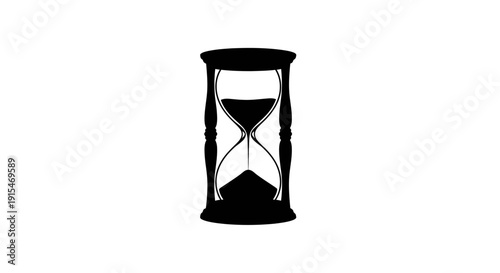 Classic hourglass with sand flowing through time measurement device.