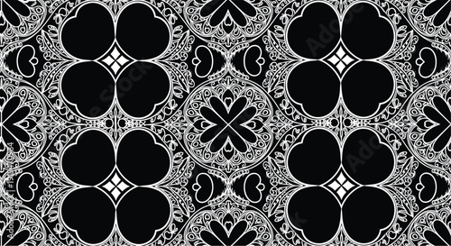 Black and white vector seamless ornamental pattern featuring intricate floral details heart shapes and 