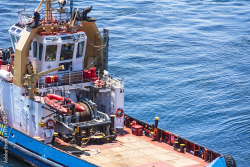 Close-up of a harbor tugboat assisting mooring operations in the port of Mejillones.