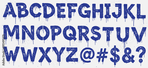 A blue graffiti alphabet with dripping letters on a white background