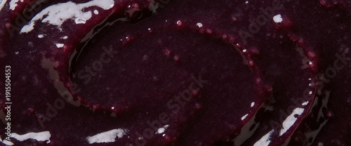 Dark purple blueberry jam or puree swirl texture macro top