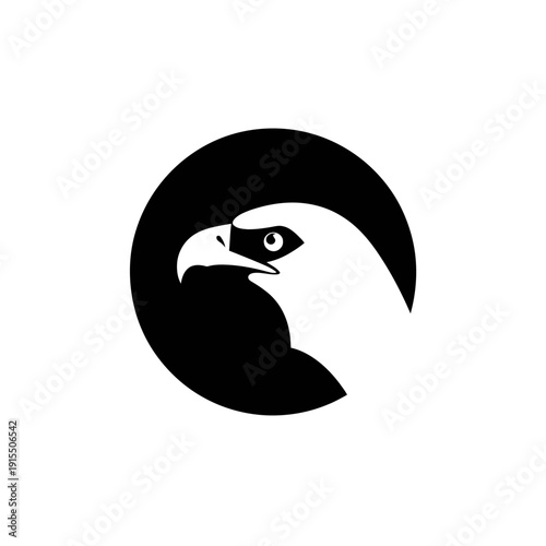 Stylized monochrome eagle head profile in a black circle. Majestic raptor bird graphic design element, symbolizing strength and freedom.