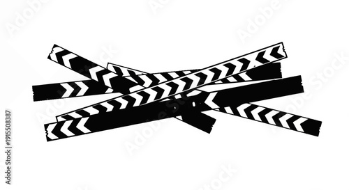 Black and white film clapboards layered in a chaotic crisscross pattern