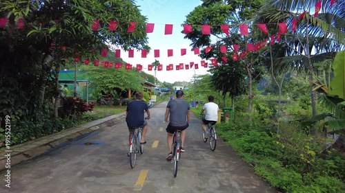 Asia. Vietnam , Ha Long Bay 02,16,2026 Tourists visit Ha Long Bay, a UNESCO World Heritage site, by bicycle - sustainable tourism in one of the seven natural wonders of the world