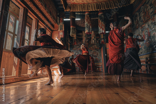 Jakar Dzong, Bhutan - 24 September 2025: View of monks in red robes dancing, their movements creating a vibrant spectacle of color and motion against the ancient walls.