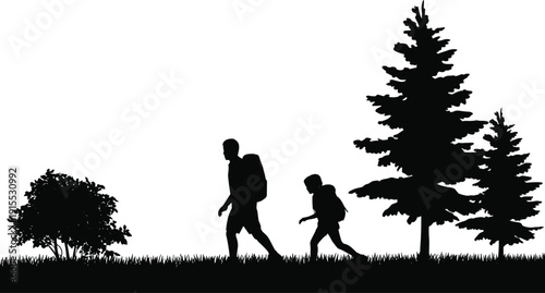 Black silhouette of an adult and child wearing backpacks while hiking through a grassy forest with pine trees for outdoor adventure and travel concepts.