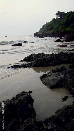 Slow motion video of waves at sunset on the beach